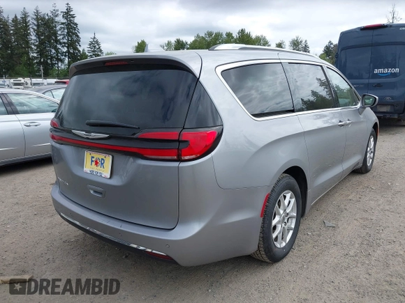 2021 Chrysler Pacifica Touring L with VIN 2C4RC1BG3MR552828, listed as a IAAI auction lot 42207838 with 67,917 mi miles and . Bid and sale history available at DreamBid. Image 4.