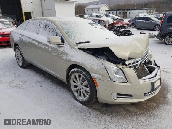 2014 Cadillac XTS Luxury z VIN 2G61M5S37E9304598, wystawiony jako IAAI lot #41006051 z przebiegiem 115 879 mil mil oraz . Historia ofert i sprzedaży dostępna na DreamBid. Obrazek 1.