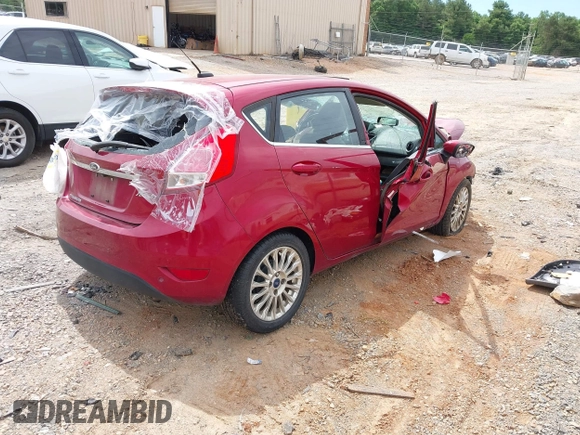 2014 Ford Fiesta Titanium z VIN 3FADP4FJ7EM204194, wystawiony jako IAAI lot #42314274 z przebiegiem 173 088 mil mil oraz . Historia ofert i sprzedaży dostępna na DreamBid. Obrazek 4.