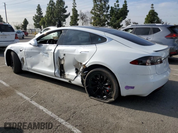 2019 Tesla Model S 100D with VIN 5YJSA1E44KF335113, listed as a Copart auction lot 82936844 with 89,770 mi miles and Salvage title. Bid and sale history available at DreamBid. Image 2.