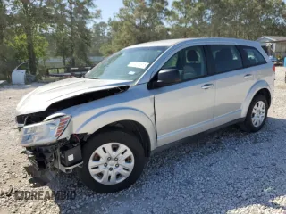 2013 Dodge Journey American Value with VIN 3C4PDCAB1DT715799, listed as a Copart auction lot 52404815 with 185,559 mi miles and Salvage Title. Bid and sale history available at DreamBid. Image 1.