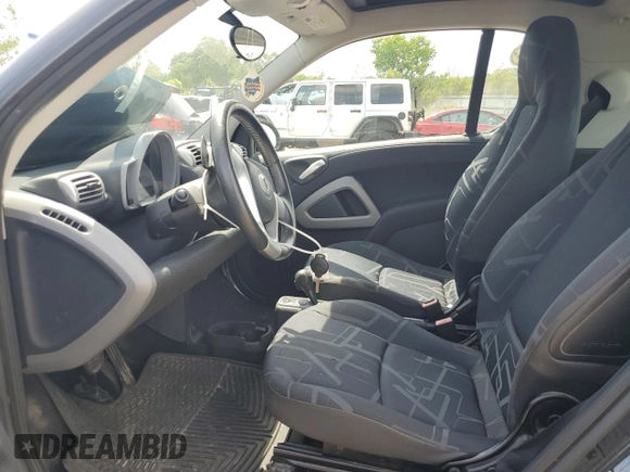 2009 Smart fortwo Pure with VIN WMEEJ31X59K218003, listed as a Copart auction lot 62413775 with 82,711 mi miles and Salvage title. Bid and sale history available at DreamBid. Image 7.