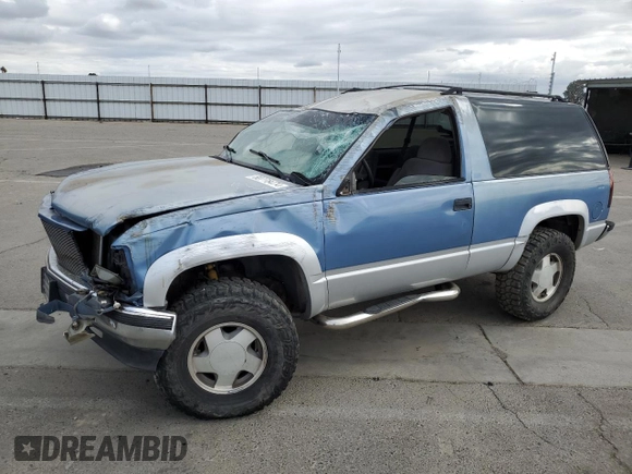 1995 GMC Yukon with VIN 1GKEK18K6SJ710419, listed as a Copart auction lot 80778474 with 215,789 mi miles and Salvage Title. Bid and sale history available at carsss.com. Image 1.