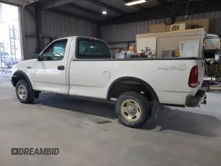 2000 Ford F-150 XL with VIN 1FTZF182XYNC09505, listed as a Copart auction lot 73420184 with 296,202 mi miles and Salvage title. Bid and sale history available at DreamBid. Image 2.