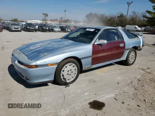 1989 Toyota Supra z VIN JT2MA70J8K0114002, wystawiony jako Copart lot #78068714 z przebiegiem 196 448 mil mil oraz Czysty tytuł • Clean title. Historia ofert i sprzedaży dostępna na DreamBid. Obrazek 1.