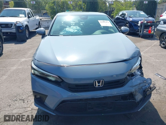 2023 Honda Civic Touring with VIN 2HGFE1F92PH322377, listed as a IAAI auction lot 42361473 with 43,533 mi miles and . Bid and sale history available at DreamBid. Image 11.