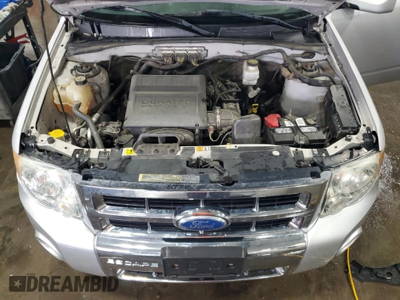 2012 Ford Escape Limited z VIN 1FMCU9EG1CKB16341, wystawiony jako Copart lot #57063845 z przebiegiem 128 205 mil mil oraz Szkoda całkowita • Salvage title. Historia ofert i sprzedaży dostępna na DreamBid. Obrazek 12.