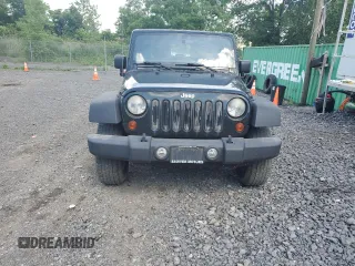2012 Jeep Wrangler Sport with VIN 1C4AJWAG6CL256792, listed as a Copart auction lot 62634515 with 137,507 mi miles and Salvage title. Bid and sale history available at DreamBid. Image 5.