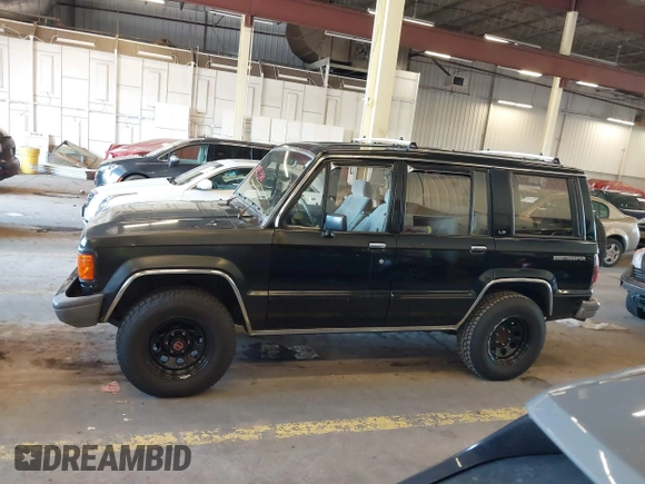 1991 Isuzu Trooper z VIN JACCH58R8M7902476, wystawiony jako IAAI lot #41893980 z przebiegiem 169 269 mil mil oraz . Historia ofert i sprzedaży dostępna na DreamBid. Obrazek 14.