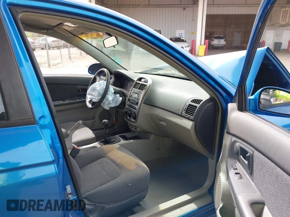 2005 Kia Spectra with VIN KNAFE161655095608, listed as a IAAI auction lot 41990765 with 51,415 mi miles. Bid and sale history available at carsss.com. Image 5.