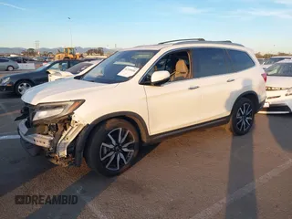 2019 Honda Pilot Touring 8-Passenger with VIN 5FNYF5H97KB005203, listed as a IAAI auction lot 41399930 with 47,267 mi miles and . Bid and sale history available at DreamBid. Image 17.