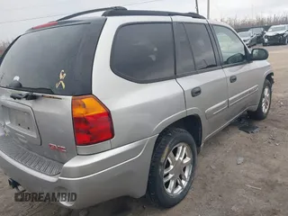 2004 GMC Envoy SLE with VIN 1GKDT13SX42135951, listed as a IAAI auction lot 41668252 with 216,193 mi miles. Bid and sale history available at carsss.com. Image 4.