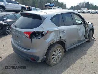2015 Mazda CX-5 Touring with VIN JM3KE2CY6F0432910, listed as a IAAI auction lot 41784545 with 210,787 mi miles. Bid and sale history available at carsss.com. Image 4.