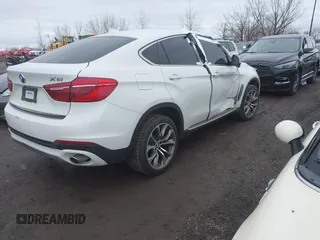 2015 BMW X6 xDrive35i with VIN 5UXKU2C57F0N77194, listed as a IAAI auction lot 41818860 with 105,579 mi miles and . Bid and sale history available at DreamBid. Image 4.