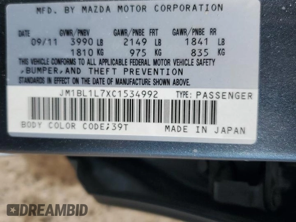 2012 Mazda 3 i Touring with VIN JM1BL1L7XC1534992, listed as a Copart auction lot 63142035 with 122,952 mi miles and Salvage title. Bid and sale history available at DreamBid. Image 12.