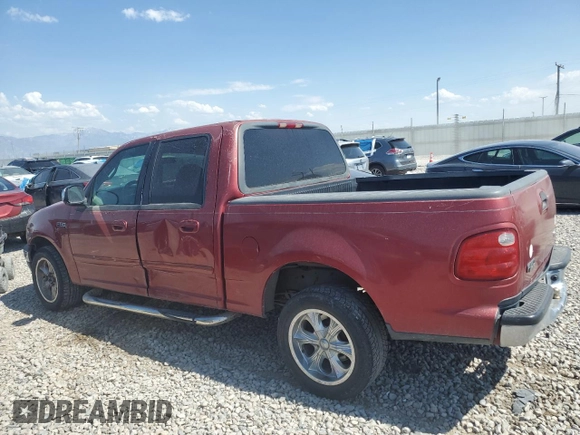 2001 Ford F-150 XLT with VIN 1FTRW07W71KE22482, listed as a Copart auction lot 62546815 with 218,501 mi miles and Clean title. Bid and sale history available at DreamBid. Image 2.