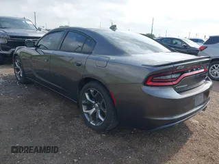 2015 Dodge Charger SXT with VIN 2C3CDXHG7FH886502, listed as a IAAI auction lot 42072027 with 105,034 mi miles and . Bid and sale history available at DreamBid. Image 3.