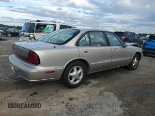 1997 Oldsmobile LSS z VIN 1G3HY52K9V4823565, wystawiony jako Copart lot #73965744 z przebiegiem 74 973 mil mil oraz Szkody całkowita. Historia ofert i sprzedaży dostępna na DreamBid. Obrazek 3.