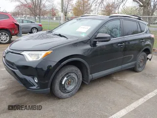 2016 Toyota RAV4 LE with VIN 2T3BFREV3GW447802, listed as a IAAI auction lot 41985438 with 213,247 mi miles. Bid and sale history available at carsss.com. Image 2.