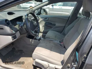 2013 Honda Insight z VIN JHMZE2H31DS000827, wystawiony jako Copart lot #60745645 z przebiegiem 172 694 mil mil oraz Szkoda całkowita • Salvage title. Historia ofert i sprzedaży dostępna na DreamBid. Obrazek 7.