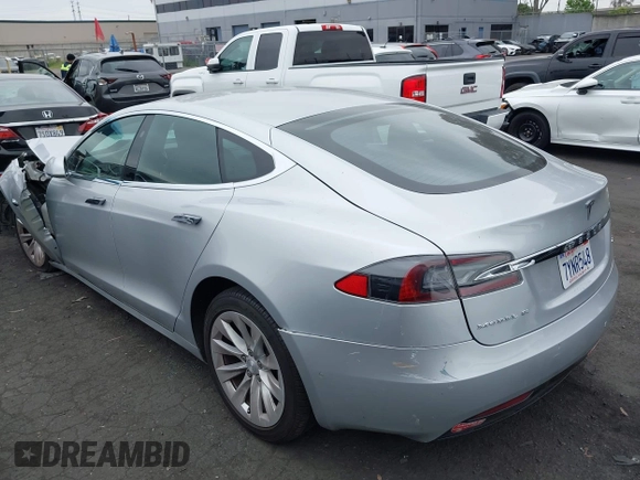 2017 Tesla Model S 100D with VIN 5YJSA1E24HF193563, listed as a IAAI auction lot 42120120 with 60,391 mi miles and . Bid and sale history available at DreamBid. Image 3.