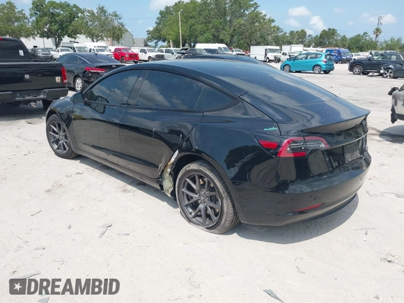2023 Tesla Model 3 z VIN 5YJ3E1EA0PF571330, wystawiony jako IAAI lot #42198817 z przebiegiem 39 682 mil mil oraz . Historia ofert i sprzedaży dostępna na DreamBid. Obrazek 3.