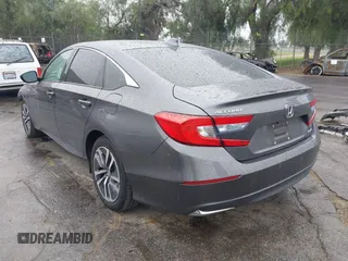2020 Honda Accord with VIN 1HGCV3F13LA015933, listed as a IAAI auction lot 41720543 with 64,943 mi miles and . Bid and sale history available at DreamBid. Image 3.