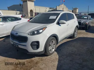 2018 Kia Sportage LX with VIN KNDPM3AC2J7445877, listed as a IAAI auction lot 41749884 with 150,320 mi miles and . Bid and sale history available at DreamBid. Image 2.