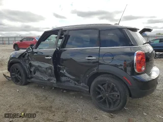 2013 MINI Cooper Countryman with VIN WMWZB3C58DWM07395, listed as a Copart auction lot 52193165 with 147,892 mi miles and Salvage Title. Bid and sale history available at carsss.com. Image 2.