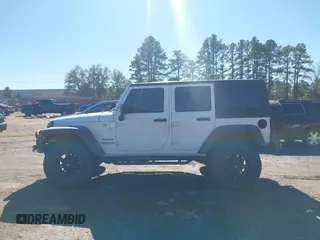 2017 Jeep Wrangler Unlimited Sport with VIN 1C4BJWDG4HL502861, listed as a IAAI auction lot 40895010 with 62,970 mi miles. Bid and sale history available at carsss.com. Image 14.