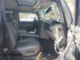 2003 Hummer H2 with VIN 5GRGN23U33H144379, listed as a IAAI auction lot 41452982 with 227,746 mi miles. Bid and sale history available at carsss.com. Image 5.