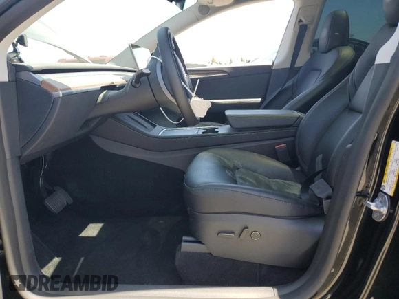 2024 Tesla Model Y Long Range with VIN 7SAYGDEE0RF123793, listed as a Copart auction lot 57177305 with 20,053 mi miles and Salvage title. Bid and sale history available at DreamBid. Image 7.