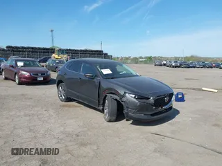 2021 Mazda CX-30 Preferred z VIN 3MVDMBCL1MM210003, wystawiony jako IAAI lot #42095739 z przebiegiem 70 258 mil mil oraz . Historia ofert i sprzedaży dostępna na DreamBid. Obrazek 1.