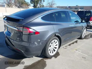 2016 Tesla Model X 70D with VIN 5YJXCBE24GF019450, listed as a IAAI auction lot 41517321 with 96,831 mi miles. Bid and sale history available at carsss.com. Image 4.
