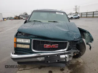 1999 GMC Yukon with VIN 1GKEK13R8XJ798496, listed as a Copart auction lot 81506634 with 117,726 mi miles and Salvage Title. Bid and sale history available at carsss.com. Image 5.