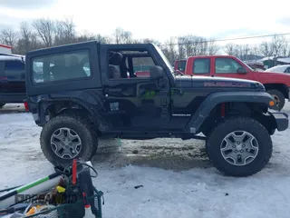 2013 Jeep Wrangler Rubicon 10th Anniversary with VIN 1C4BJWCG3DL591186, listed as a IAAI auction lot 41315969 with 54,984 mi miles and . Bid and sale history available at DreamBid. Image 14.