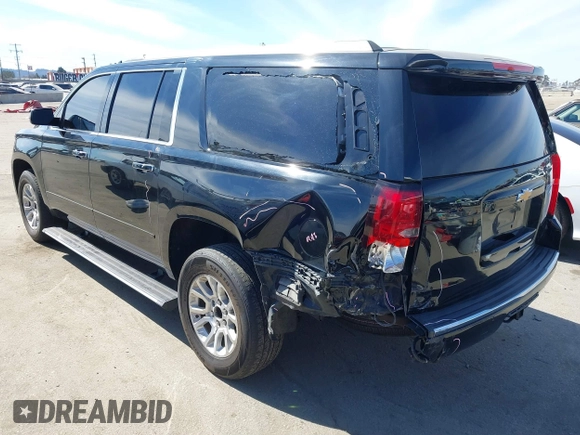 2019 Chevrolet Suburban LT with VIN 1GNSCJKCXKR332739, listed as a IAAI auction lot 41636530 with 104,997 mi miles and . Bid and sale history available at DreamBid. Image 3.