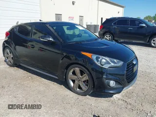 2013 Hyundai Veloster Turbo w/Black Int with VIN KMHTC6AE8DU175611, listed as a IAAI auction lot 42057549 with 137,929 mi miles. Bid and sale history available at carsss.com. Image 1.
