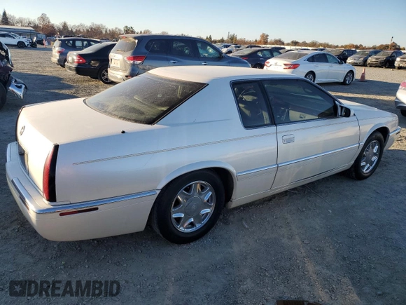 2002 Cadillac Eldorado z VIN 1G6EL12Y12B100821, wystawiony jako Copart lot #83495214 z przebiegiem 36 358 mil mil oraz Czysty tytuł • Clean title. Historia ofert i sprzedaży dostępna na DreamBid. Obrazek 3.