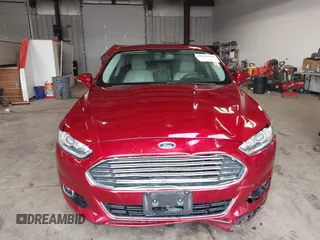 2016 Ford Fusion Titanium z VIN 3FA6P0K95GR119017, wystawiony jako IAAI lot #42148460 z przebiegiem 84 770 mil mil oraz . Historia ofert i sprzedaży dostępna na DreamBid. Obrazek 12.