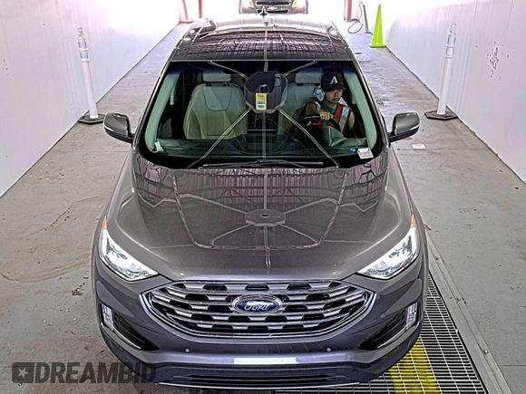 2021 Ford Edge Titanium z VIN 2FMPK3K92MBA53689, wystawiony jako IAAI lot #42501151 z przebiegiem 93 941 mil mil oraz . Historia ofert i sprzedaży dostępna na DreamBid. Obrazek 1.
