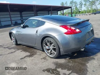 2013 Nissan 370Z with VIN JN1AZ4EH1DM880983, listed as a IAAI auction lot 41937876 with 130,613 mi miles. Bid and sale history available at carsss.com. Image 3.