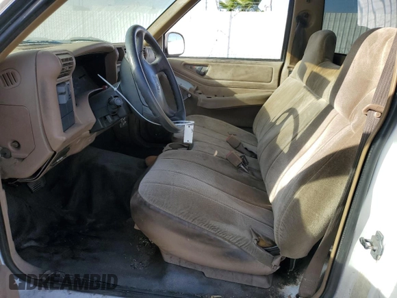 1995 GMC Sonoma z VIN 1GTCS14Z5S8536775, wystawiony jako Copart lot #77086374 z przebiegiem 70 419 mil mil oraz Tytuł czysty. Historia ofert i sprzedaży dostępna na DreamBid. Obrazek 7.
