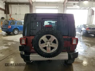 2008 Jeep Wrangler Unlimited Sahara z VIN 1J4GA59198L570409, wystawiony jako Copart lot #58853295 z przebiegiem 84 502 mil mil oraz Nie do naprawy • Non repairable. Historia ofert i sprzedaży dostępna na DreamBid. Obrazek 6.