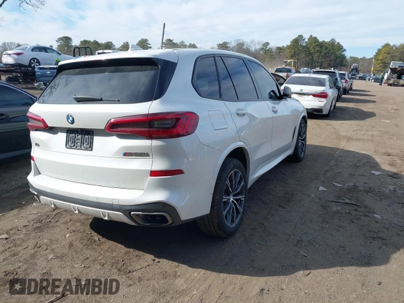 2020 BMW X5 M50i with VIN 5UXJU4C06LLE45651, listed as a IAAI auction lot 41618355 with 70,885 mi miles and . Bid and sale history available at DreamBid. Image 4.