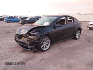 2023 Tesla Model Y Long Range z VIN 7SAYGDEE2PA166042, wystawiony jako IAAI lot #41348960 z przebiegiem Nie podano mil oraz . Historia ofert i sprzedaży dostępna na DreamBid. Obrazek 17.