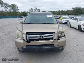 2006 Honda Pilot EX-L with VIN 5FNYF28566B010295, listed as a IAAI auction lot 41654433 with 302,539 mi miles. Bid and sale history available at carsss.com. Image 12.