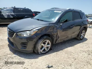 2016 Mazda CX-5 Sport with VIN JM3KE2BY4G0669933, listed as a Copart auction lot 55856365 with 113,668 mi miles and Salvage title. Bid and sale history available at DreamBid. Image 1.