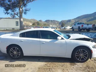 2019 Dodge Charger SXT with VIN 2C3CDXJGXKH533322, listed as a IAAI auction lot 41808838 with 95,877 mi miles and . Bid and sale history available at DreamBid. Image 14.