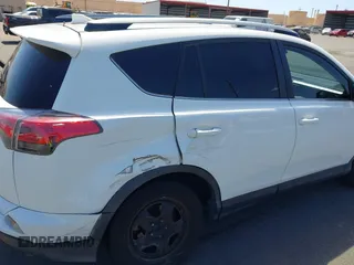 2017 Toyota RAV4 LE with VIN JTMZFREV2HJ721392, listed as a IAAI auction lot 41697170 with 59,357 mi miles and . Bid and sale history available at carsss.com. Image 6.